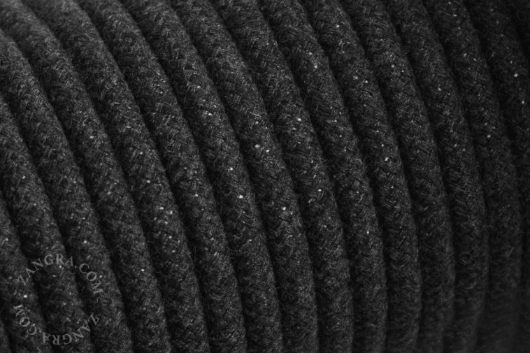 Electrical cable covered in dark grey cotton.