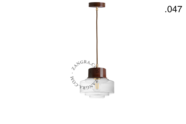 Brown pendant light with glass shade.