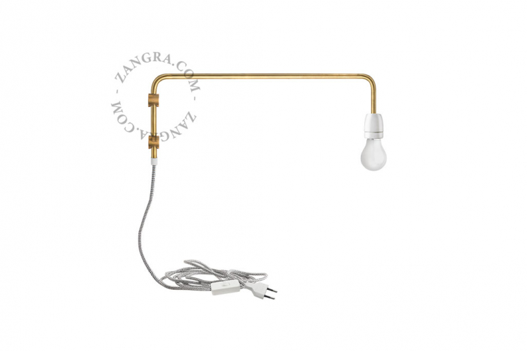 white porcelain and brass wall light with swing arm and plug