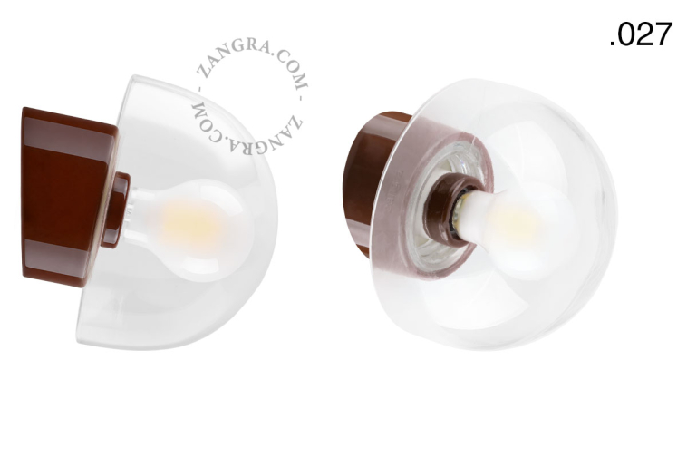 Brown porcelain wall light with glass lampshade.