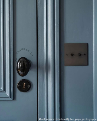 Black porcelain doorknob.