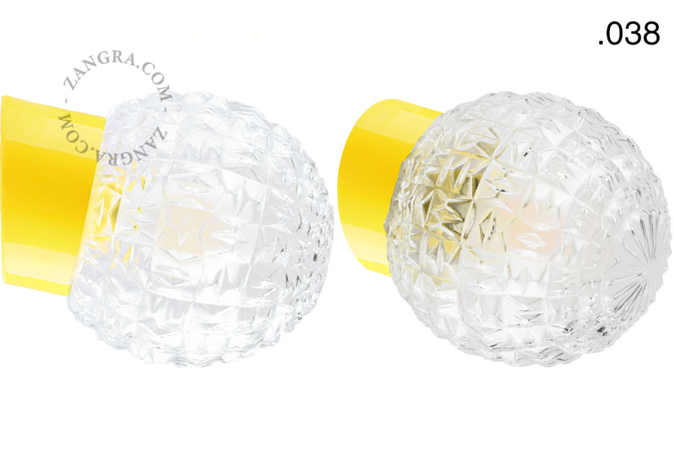 Yellow porcelain wall light with glass lampshade.