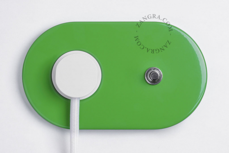 Green ovale outlet & switch with pushbutton.