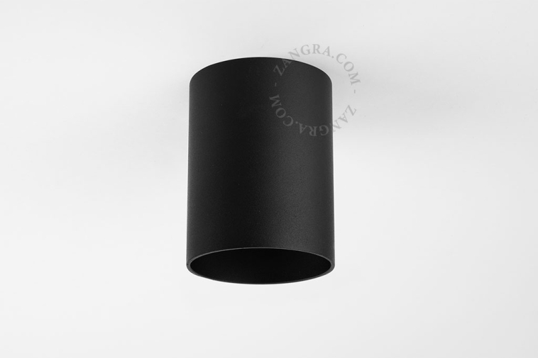 Surface-mounted cylindrical spotlight.