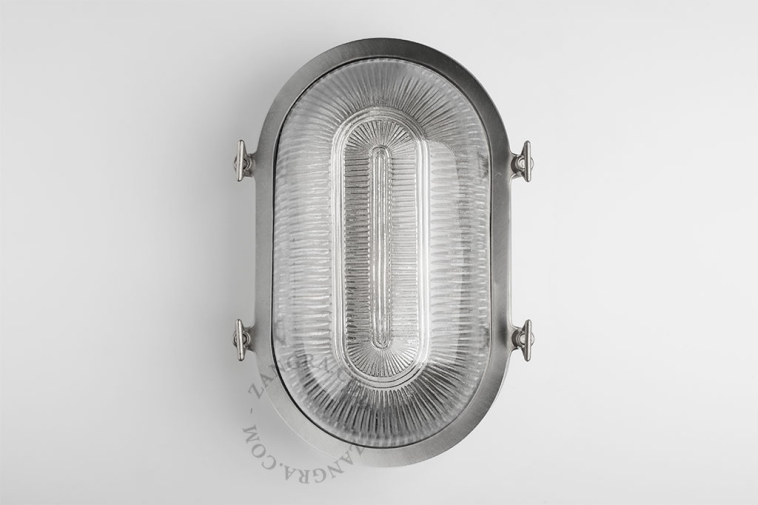 Nickel-plated bulkhead light with prismatic glass.