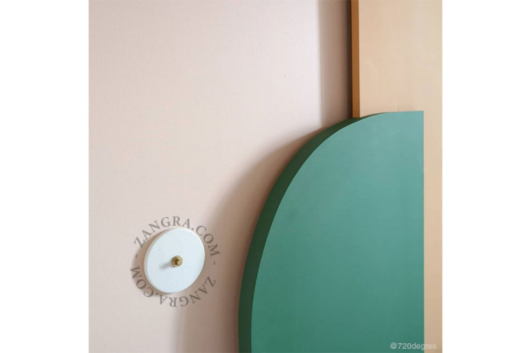 Round white porcelain light switch.