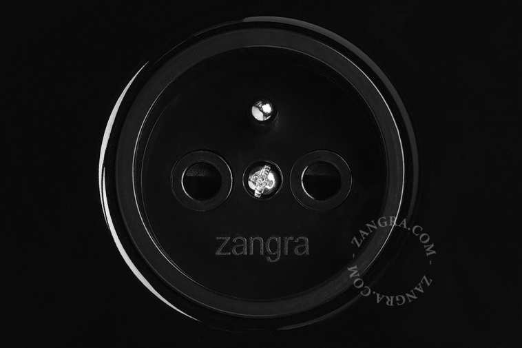 Black wall outlet with double switch with nickel-plated pushbuttons.