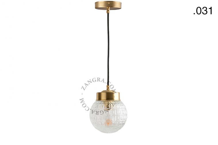 Brass pendant light with glass shade.