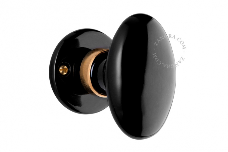 Doorknob in black porcelain and brass.