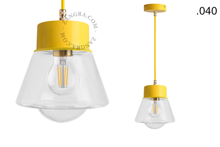 Yellow pendant light with glass shade.