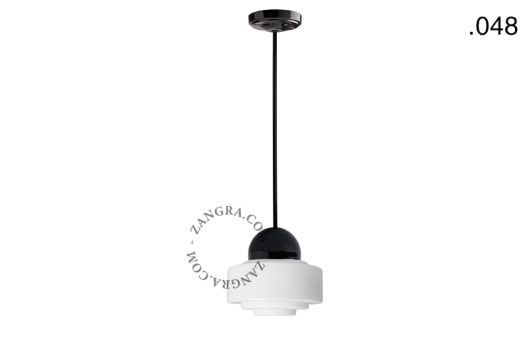 Black porcelain ceiling light with glass shade.