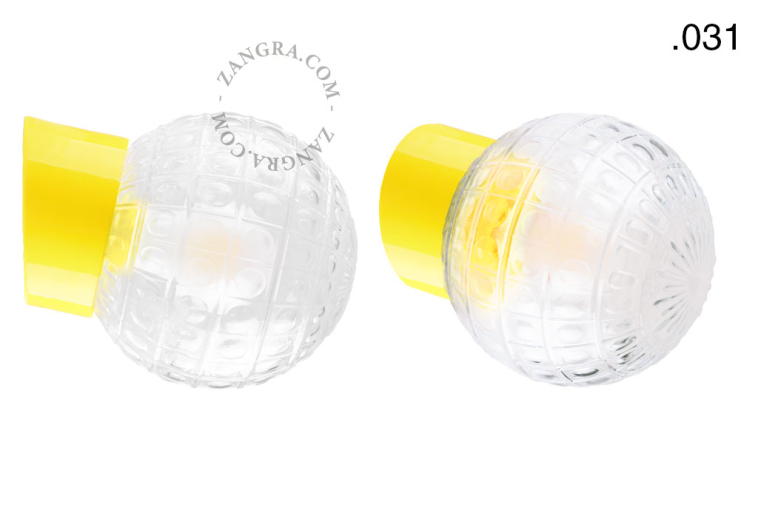 Yellow porcelain wall light with glass lampshade.