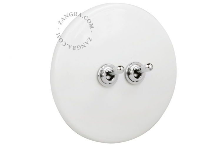 White porcelain switch with double nickel-plated toggle.