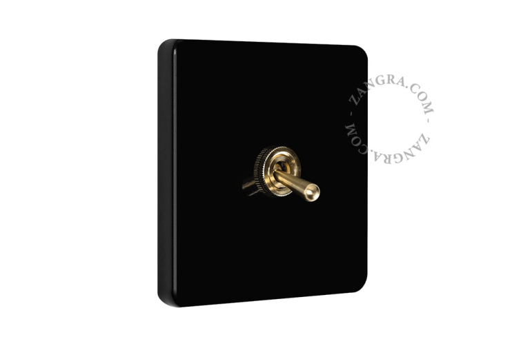 Vierkante lichtschakelaar in zwart porselein.