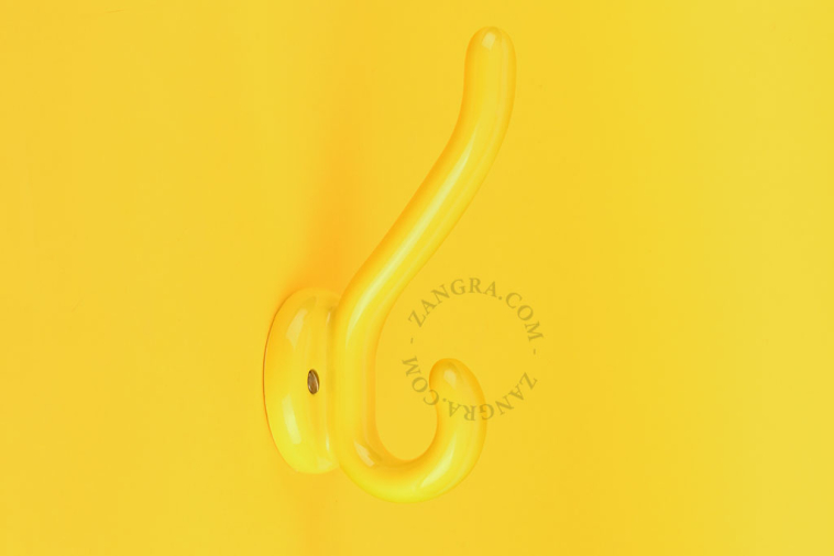 Yellow porcelain double coat hook.