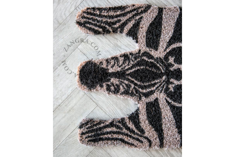 Zebra-shaped coir doormat.