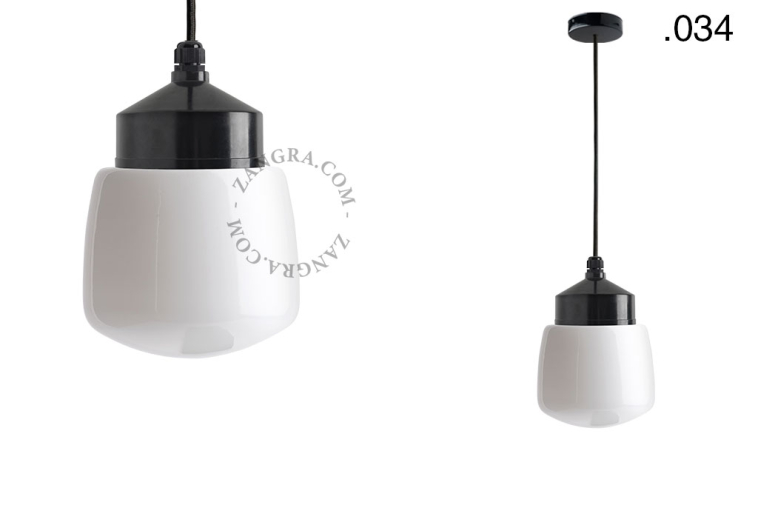 Black bakelite pendant light with glass shade.