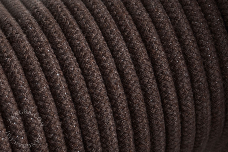 Electrical cable covered in brown cotton.
