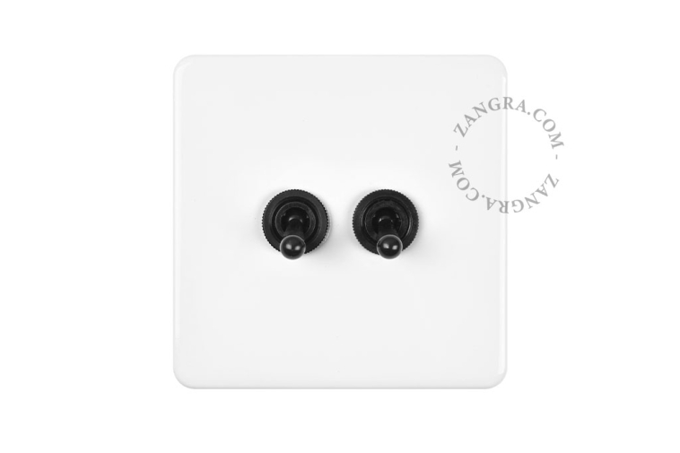 White porcelain square-shaped switch.