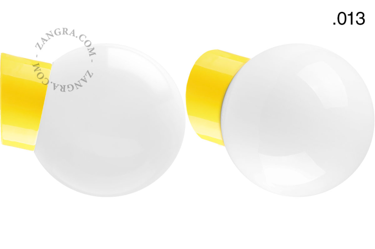 Yellow porcelain wall light with glass lampshade.