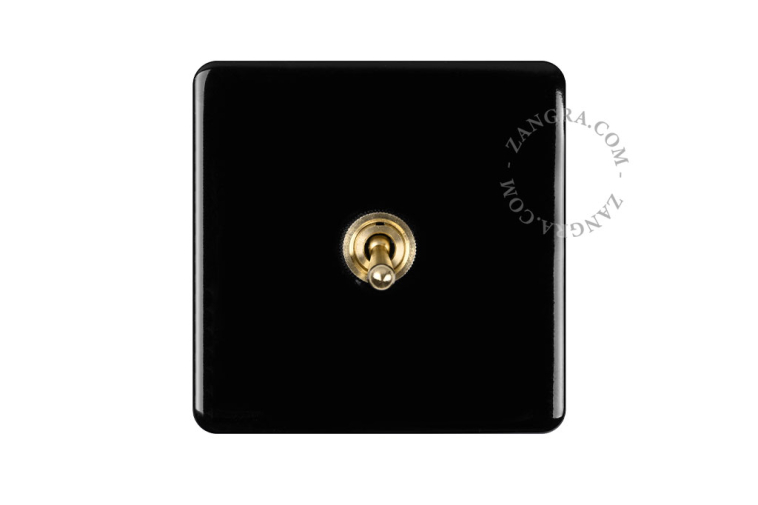 Vierkante lichtschakelaar in zwart porselein.