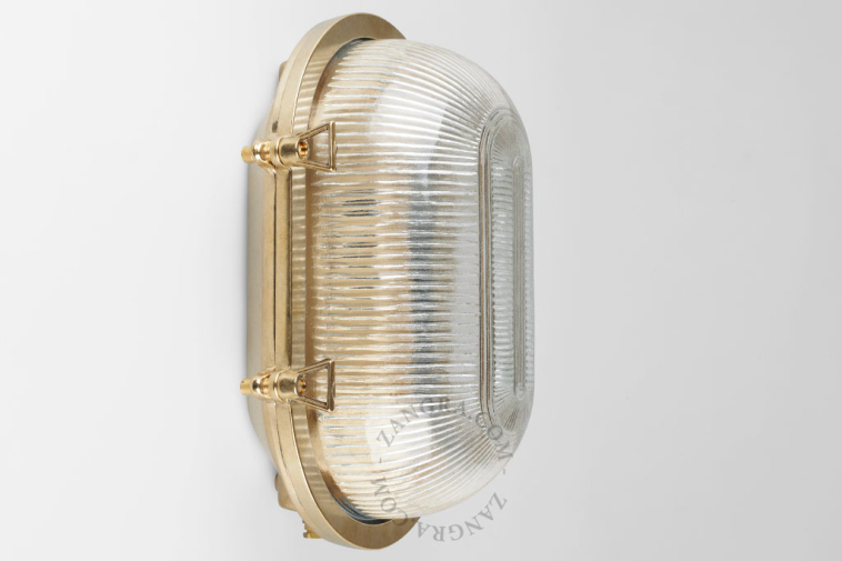 Brass bulkhead light with prismatic glass.