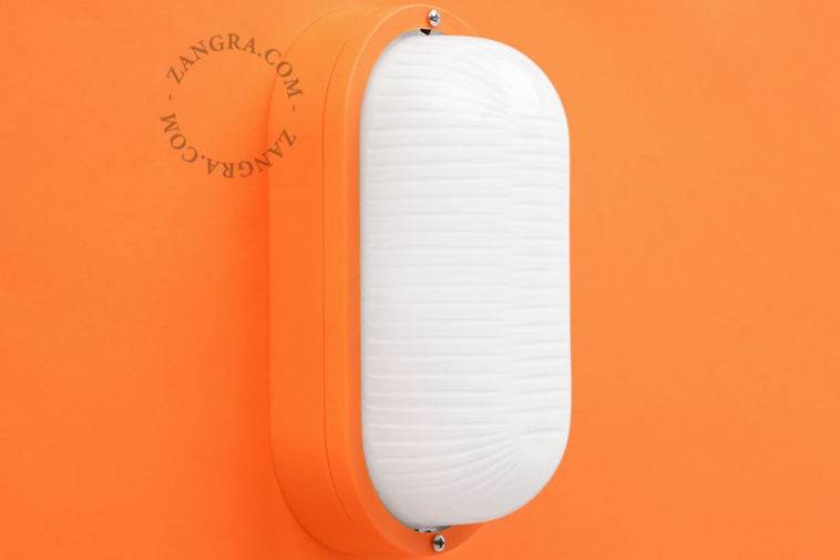 Oval orange bulkhead light.