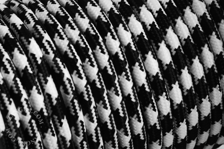 Black and white houndstooth fabric cable.