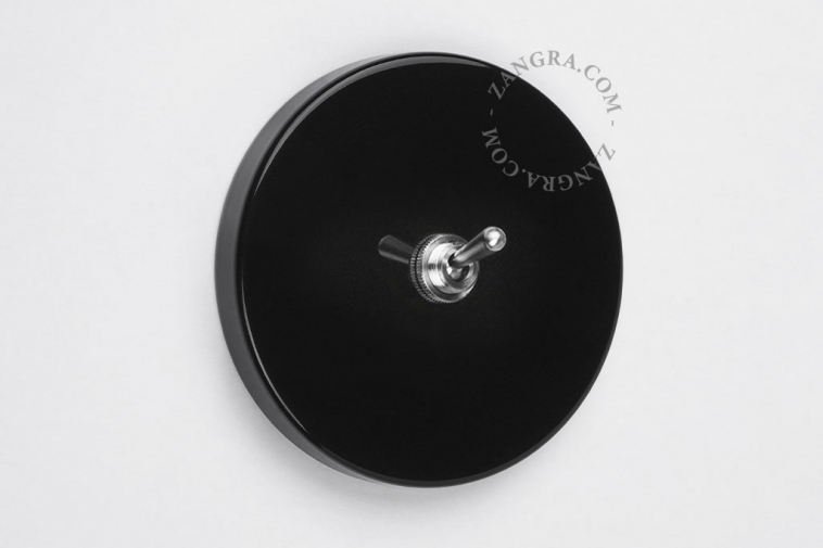 interrupteur noir avec levier en laiton nickele