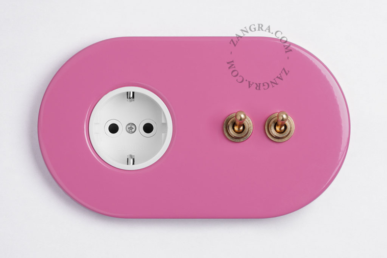 pink flush mount outlet & two-way or simple switch – double raw brass toggle