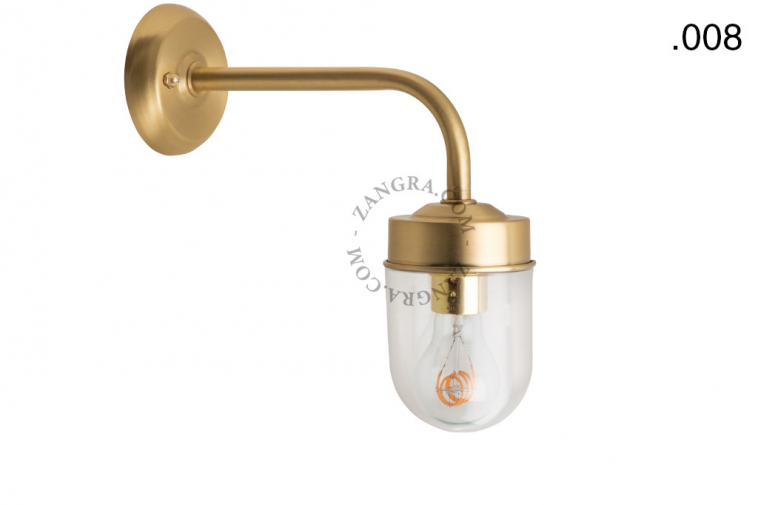 Brass retro wall light with glass globe for bathroom or outdoor use.