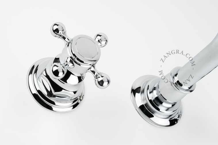 Concealed washbasin tap with two cross handles.