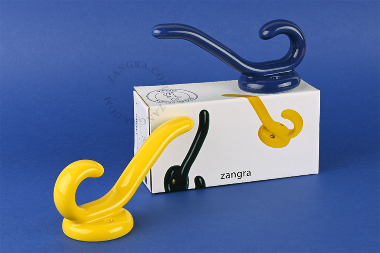 Yellow porcelain double coat hook.