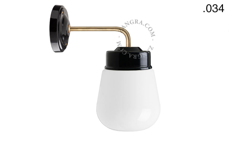 Retro black porcelain wall light with glass shade.