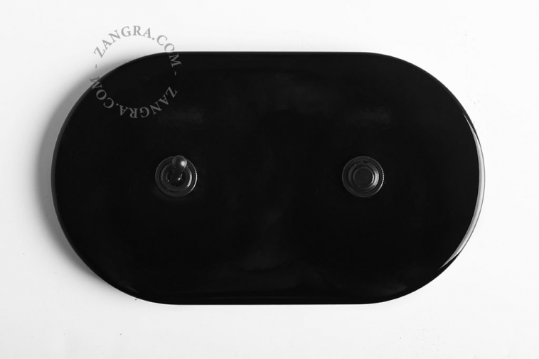 interrupteur noir avec bouton poussoir et levier va-et-vient en laiton noir