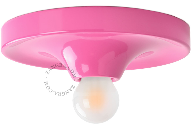 Rund lyserød lampe.