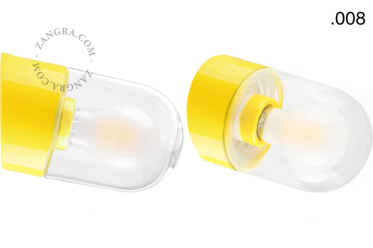 Yellow porcelain wall light with glass lampshade.