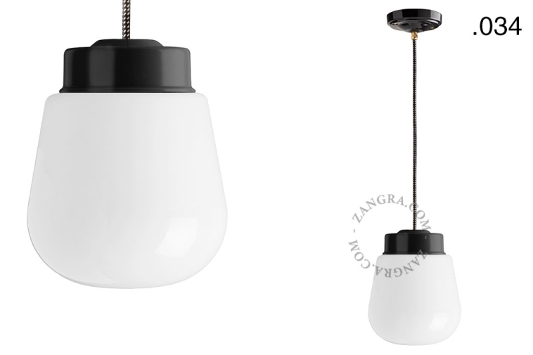 Black porcelain pendant light with glass shade.
