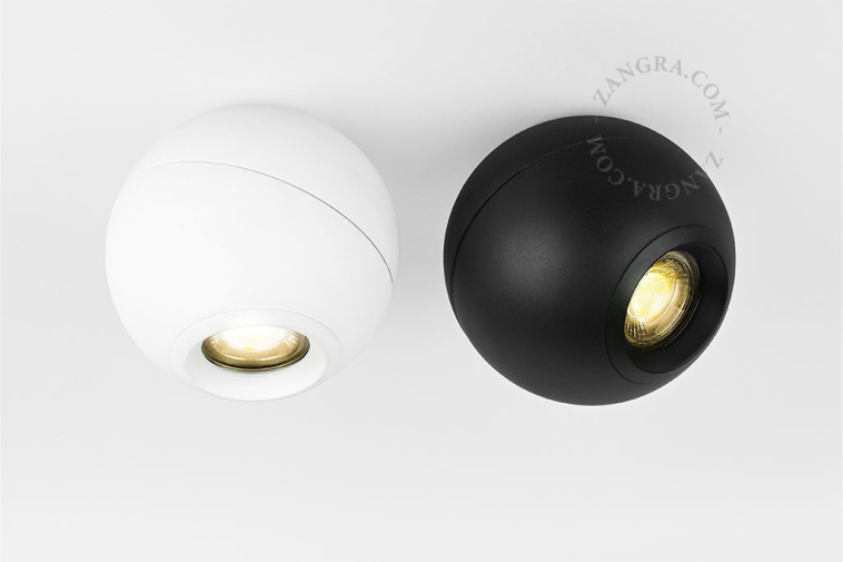 Adjustable and dimmable surface-mounted spotlight.
