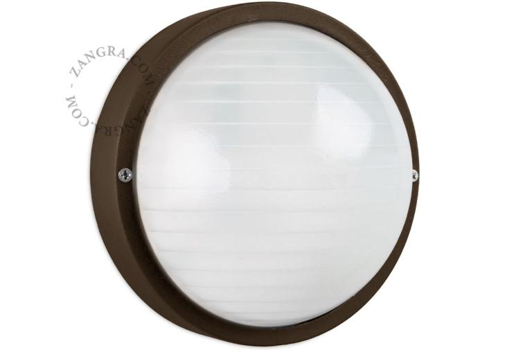 Round, brown bulkhead light.