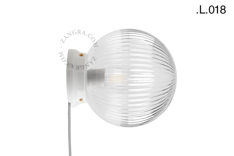 Art Deco light in porcelain with glass shade.