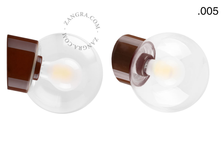 Brown porcelain wall light with glass lampshade.