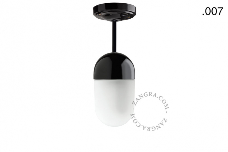 Black porcelain ceiling light with glass shade.