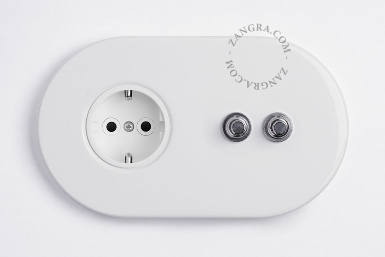 White wall outlet with 2 nickel-plated pushbuttons.