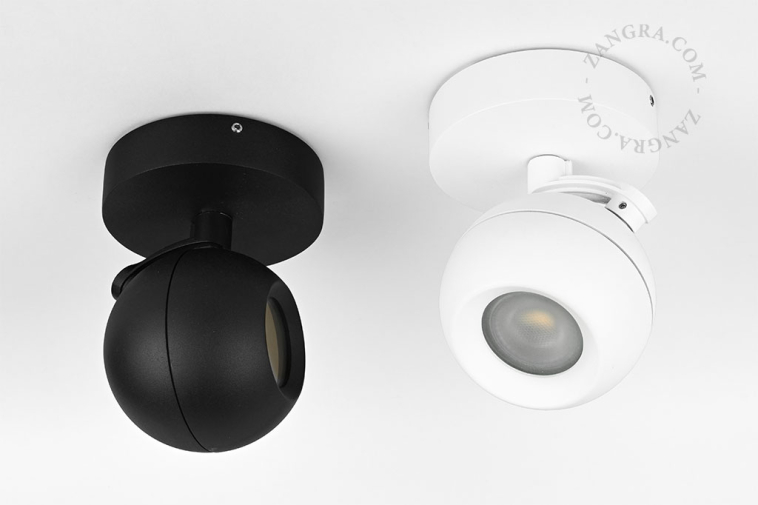 Surface-mounted adjustable LED spotlight for outdoor lighting.