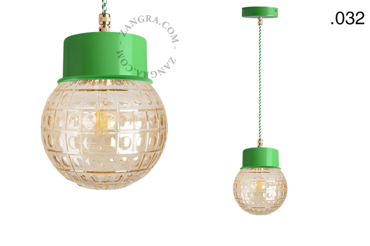 Green pendant light with glass shade.