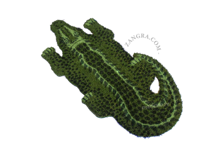 Crocodile-shaped coir doormat.