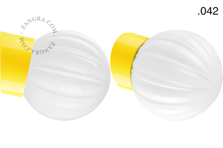 Yellow porcelain wall light with glass lampshade.