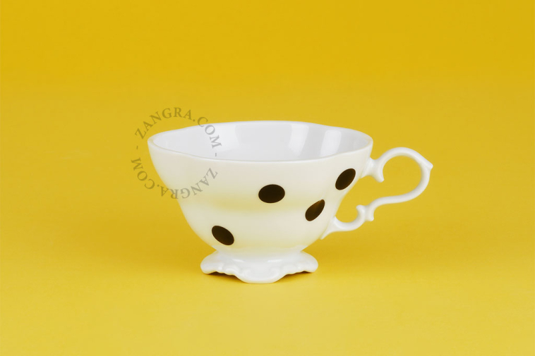 Black dot porcelain cup.