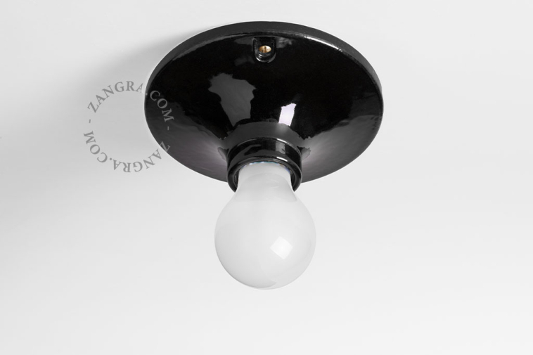 Black porcelain round light fixture.